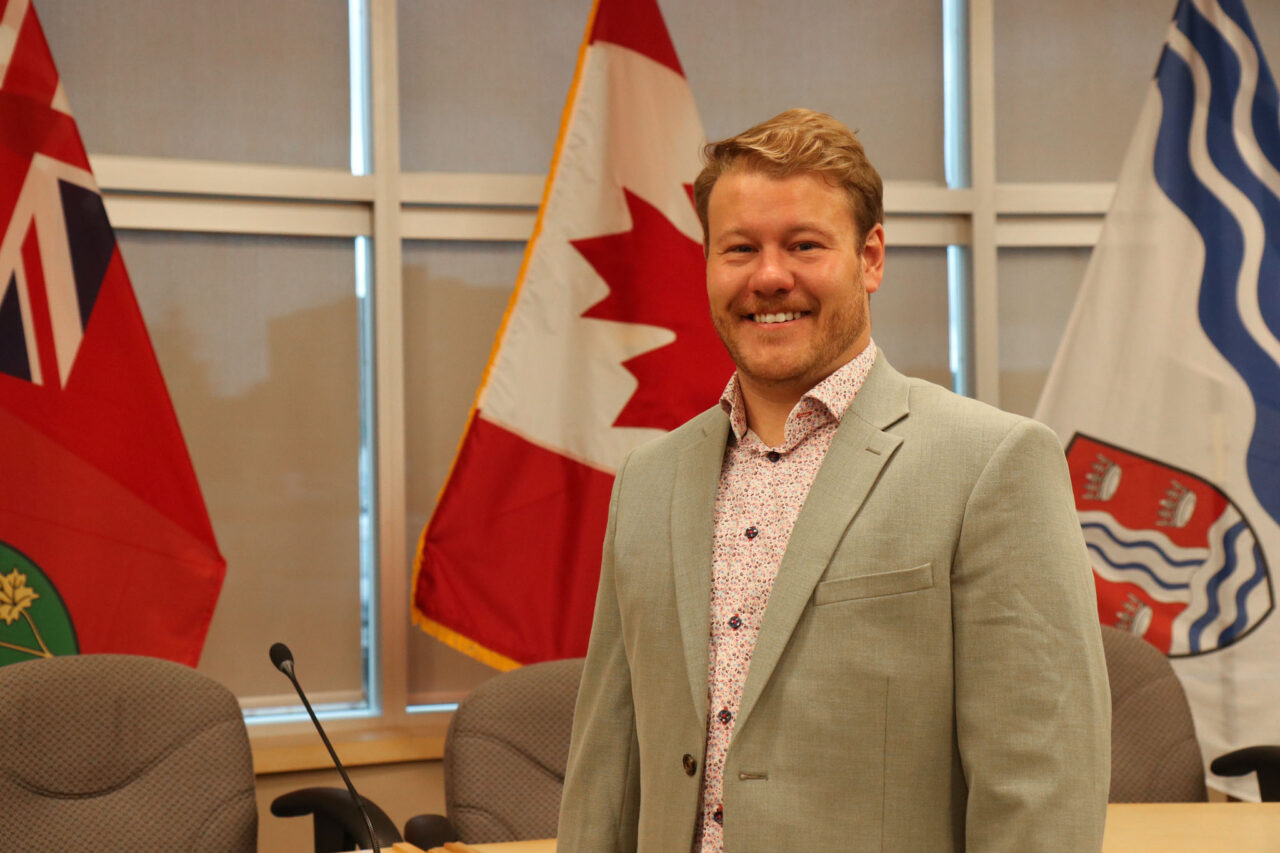 Headshot of Josh Machesney, Director of Corporate Services/City Clerk in Quinte West Council Chambers